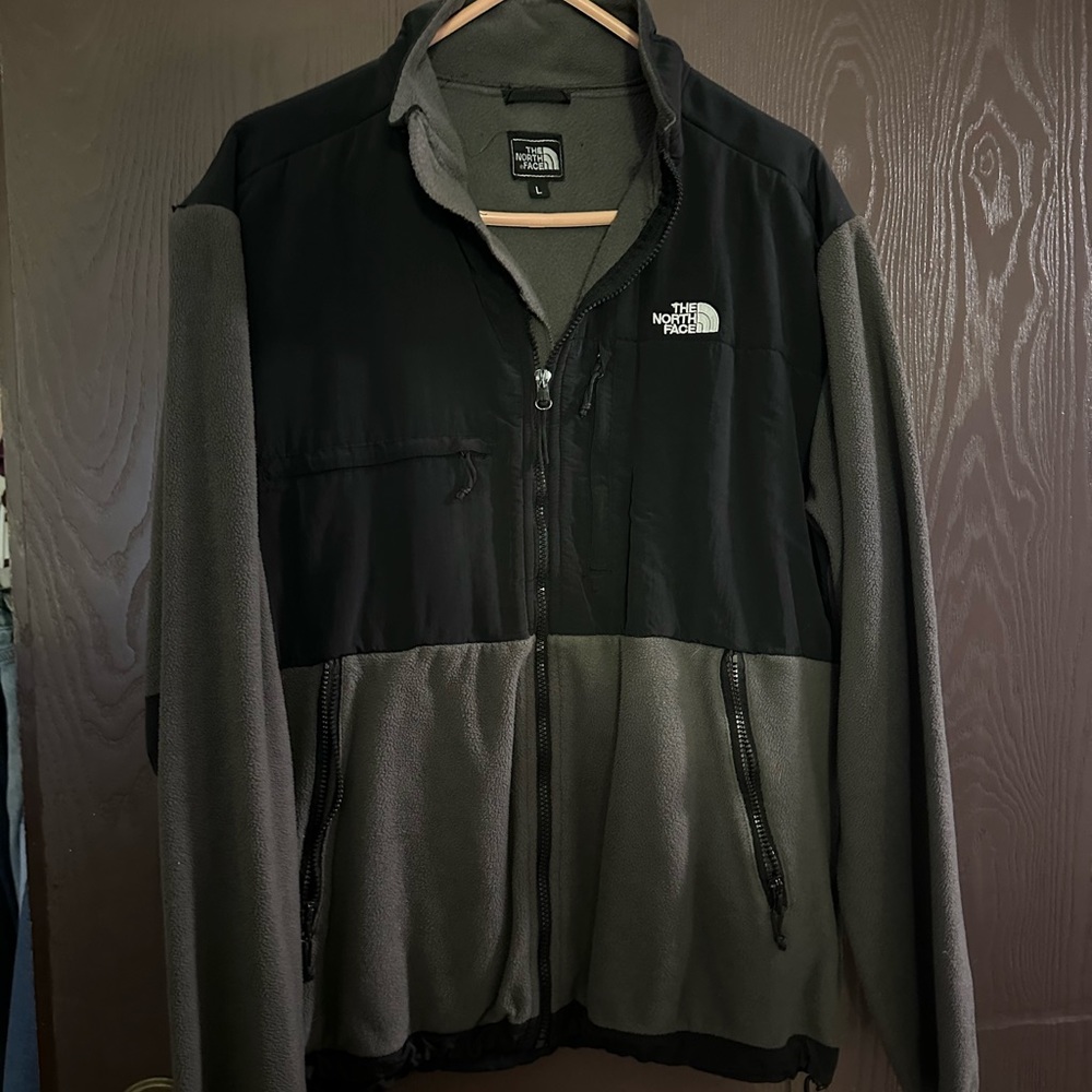 Woman’s large grey & black north face. Says L but fits like XL.